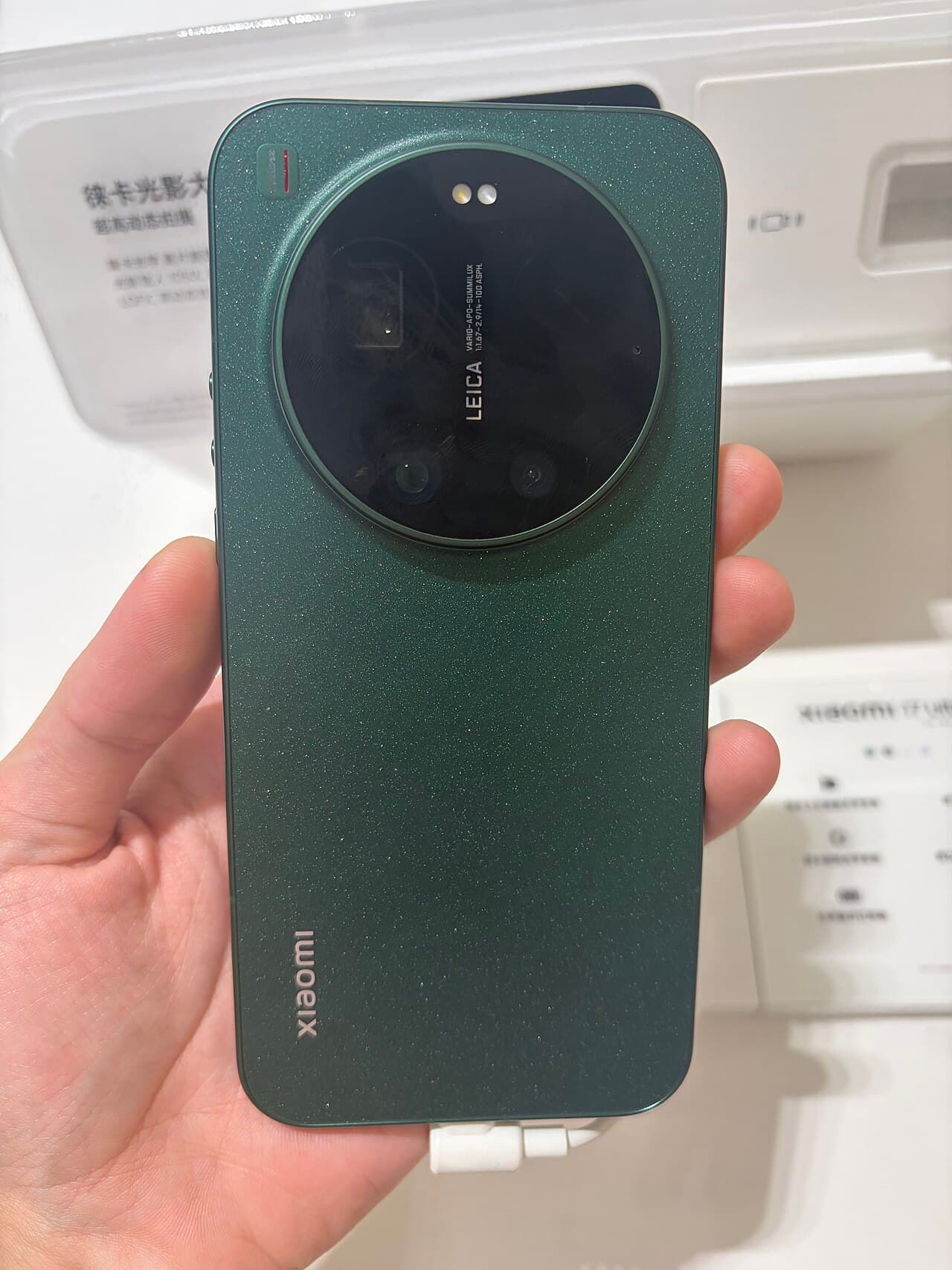Back of the Xiaomi 17 Ultra in green with its Leica camera module