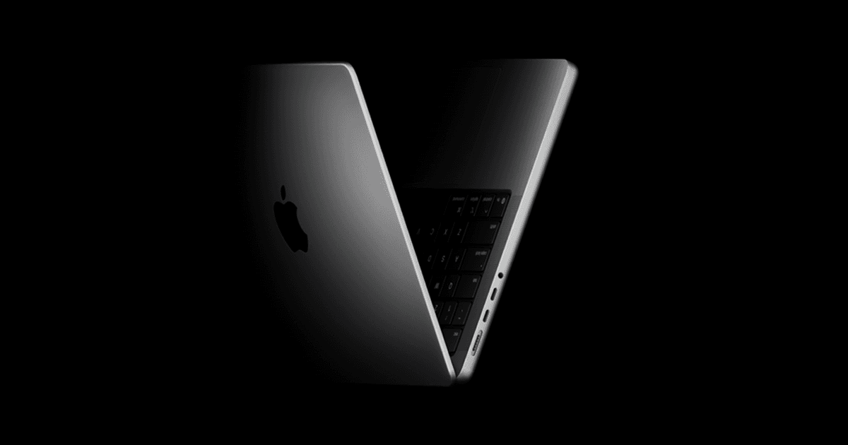 MacBook Pro in Space Black, shown closing with the keyboard and Apple logo visible.