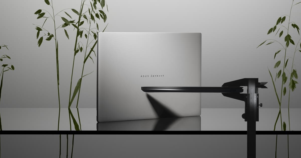 ASUS Zenbook S 14 shown closed from the back in silver, with the 'ASUS Zenbook' logo visible on the lid.