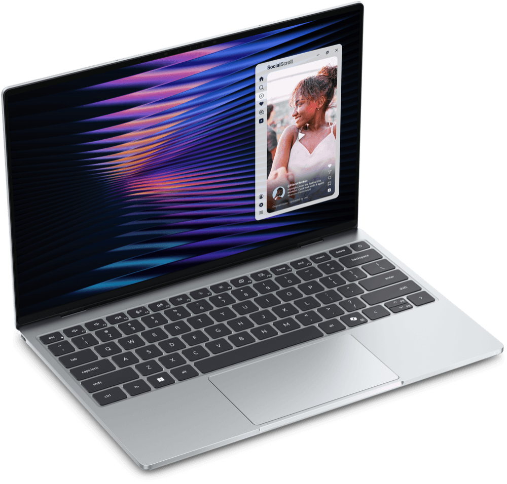 Dell XPS 13 laptop open at an angle, showing the keyboard and a social media app on screen.