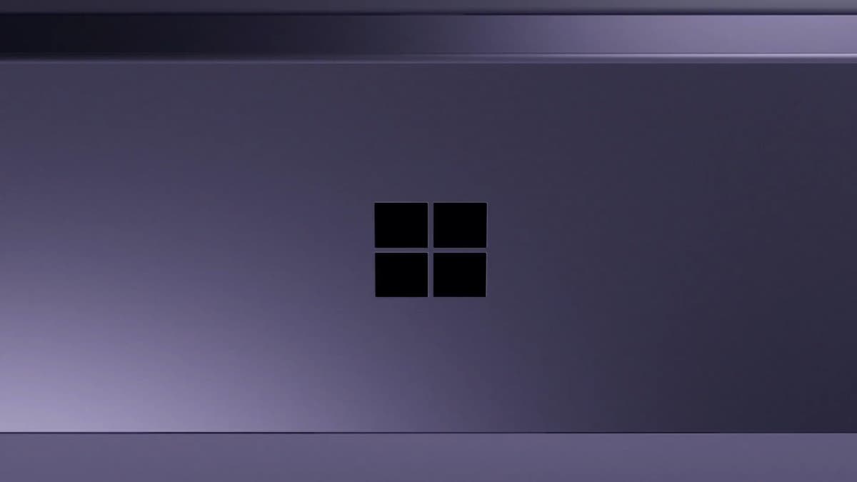 Microsoft Surface Pro (11th Edition) in a dark violet finish, showing the Windows logo on its rear kickstand panel